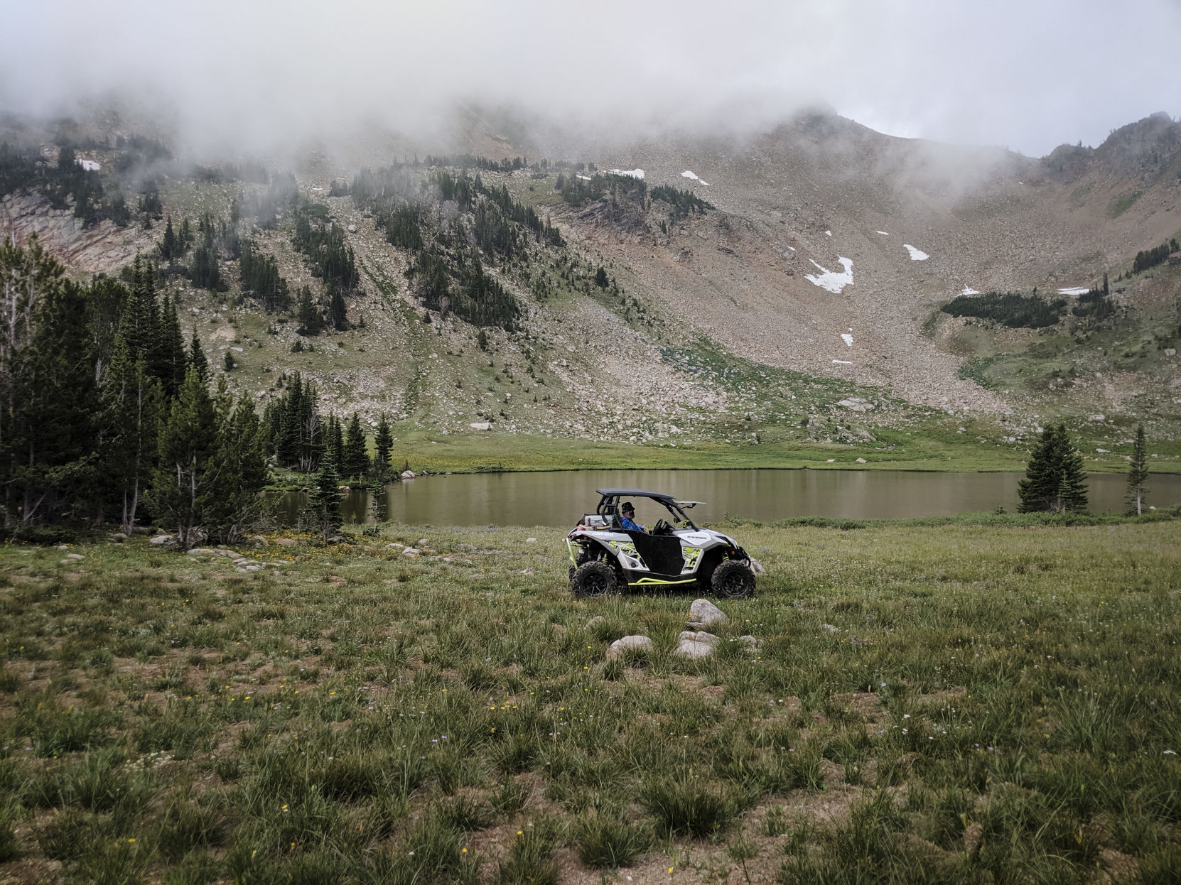 Bill Bahny in his UTV next to Granite Lake.
